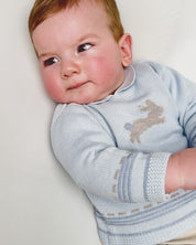 BABY SWEATER IN LIGHT BLUE WITH A BUNNY KNIT DETAIL